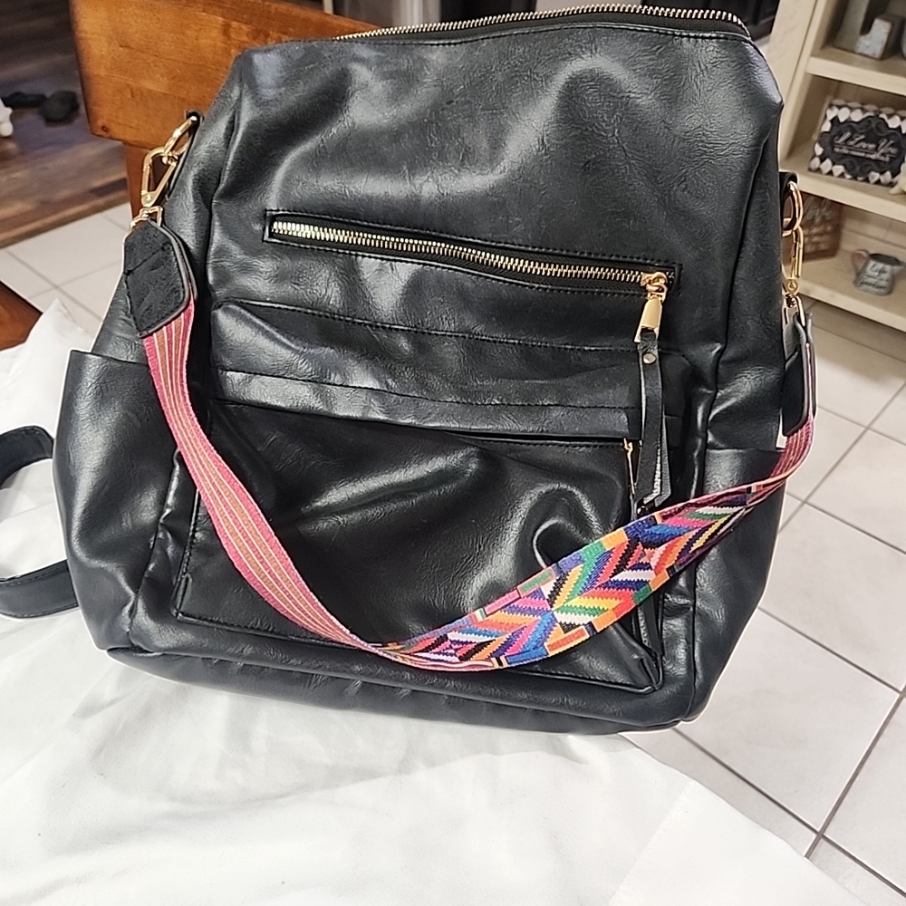 Chic Black Backpack With Vibrant Strap - image 1